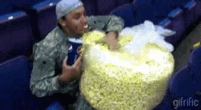 popcorn-eating-812016270.gif