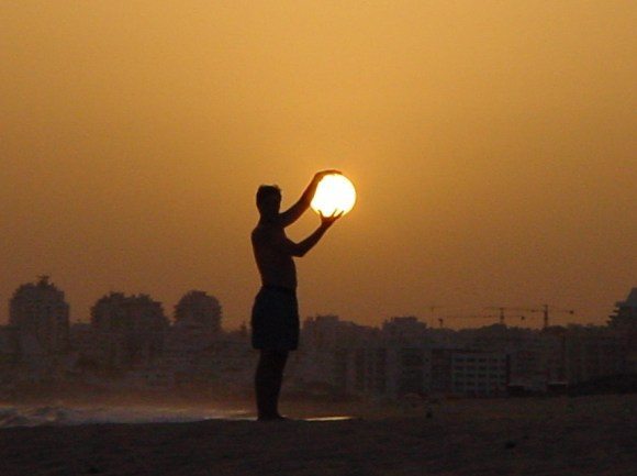 man-holding-sun.jpg